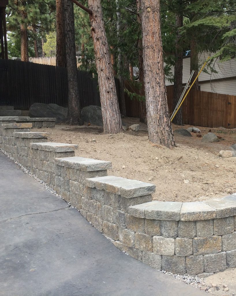 Stepped Retaining Wall next to driveway by Earth &amp; Stone Landscapes for Tahoe and surrounding areas