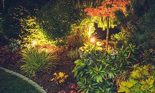 A backyard landscape lighting example by Earth & Stone Landscapes for Tahoe and surrounding areas.